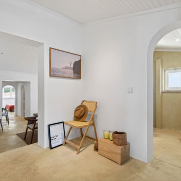 Entry with Cane Chair and Arched Openings