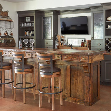 Antique Bar with Apothecary Drawers and Gray Perimeter Cabinets