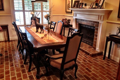 Example of a classic brick floor kitchen/dining room combo design in Tampa with a brick fireplace