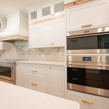 Modern and Bright Kitchen with Floor to Ceiling Storage and Rolling Ladder
