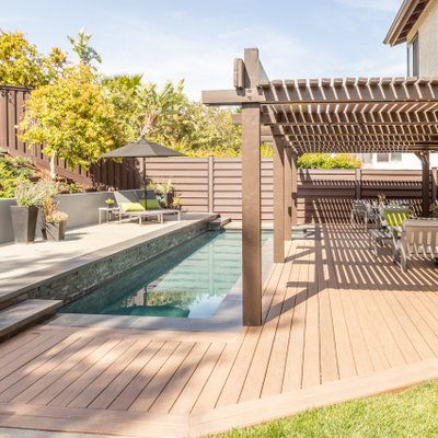 Trendy rectangular pool photo in Los Angeles with decking