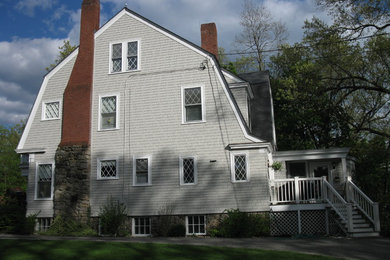 Large traditional gray three-story wood house exterior idea in New York with a gambrel roof and a shingle roof