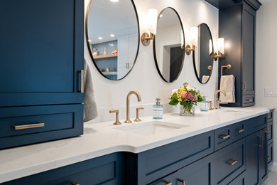Bathroom - coastal master blue tile and subway tile porcelain tile, beige floor and double-sink bathroom idea in Other with recessed-panel cabinets, blue cabinets, white walls, an undermount sink, quartz countertops, a hinged shower door, white countertops and a built-in vanity