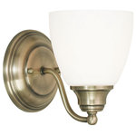 Livex Lighting - Somerville Wall Sconce, Antique Brass - The hand blown satin opal white shades extend from gently curved arms reaching from the round backplate and are finished with small, orb finials at both ends to reinforce the curvaceous motif.