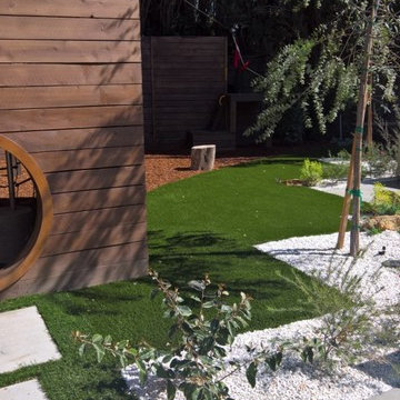 backyard with play structure, fire pit table and new patio