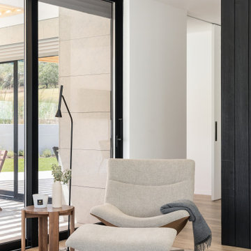 Reading Armchair by Full-Height Glazing