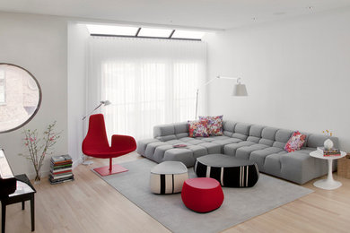 Living room - scandinavian light wood floor living room idea in Chicago with white walls