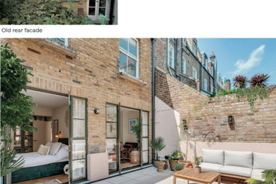 This is an example of a medium sized urban back ground level terrace in London.
