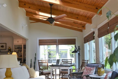Photo of a traditional sunroom in Richmond with light hardwood floors and a skylight.