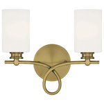 Savoy House - Woodbury 2-Light Bath Vanity Fixture, Warm Brass - A graceful scroll flourish distinguishes the Woodbury Collection of bath bars. Measuring 14" wide x 12" high x 7" extension this two-light bath bar in a versatile pairing of a Warm Brass finish with White glass provides ample illumination from two 60-watt Edison-base bulbs.