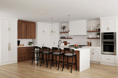 Minimalist kitchen photo with flat-panel cabinets, white cabinets, stainless steel appliances and an island