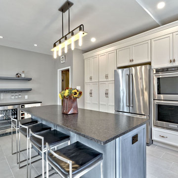 White Kitchen Remodel with Blue Island and Copper Accents