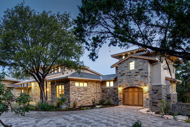 Example of a mid-sized arts and crafts attached one-car carport design in Austin