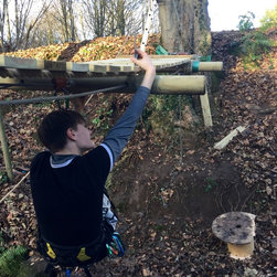 Working in a harness to create a river Rope Bridge - Garden Products