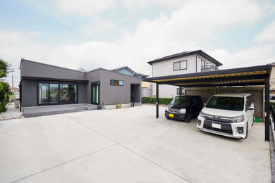 Diseño de fachada de casa gris minimalista de una planta con tejado de un solo tendido