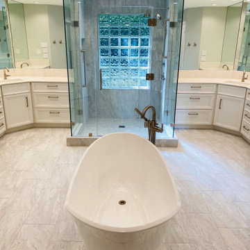 Freestanding Tub is the Center of White on White Owner's Bath