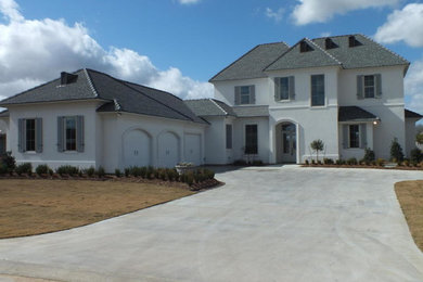 This is an example of a transitional two-storey brick white exterior in New Orleans.