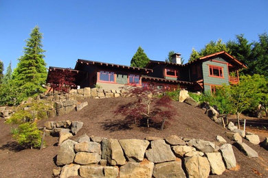 Inspiration for a mid-sized craftsman green two-story wood gable roof remodel in Portland