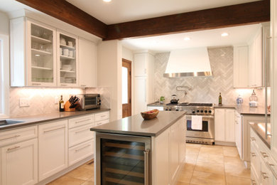Inspiration for a mid-sized transitional u-shaped ceramic tile, beige floor and exposed beam eat-in kitchen remodel in Denver with a single-bowl sink, flat-panel cabinets, white cabinets, quartz countertops, gray backsplash, marble backsplash, stainless steel appliances, an island and gray countertops