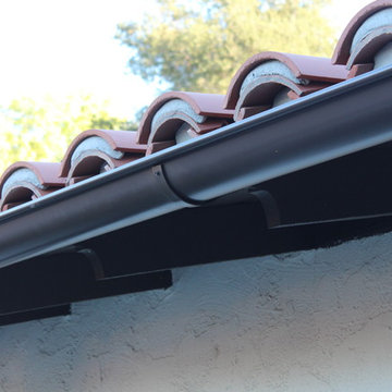 Half Round Rain Gutters with Wrap Around 10 Gauge Twisted Rafter Mount Brackets
