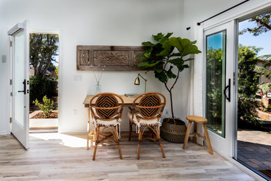 Mid-sized transitional beige floor single front door photo in San Diego with white walls and a white front door
