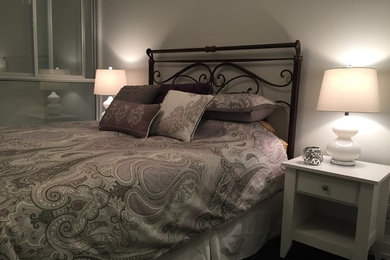 Example of a transitional bedroom design in Toronto