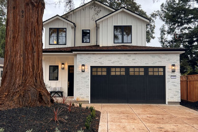 Mid-sized white two-story wood and board and batten exterior home idea in San Francisco with a shingle roof and a black roof