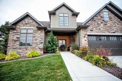Large arts and crafts two-story mixed siding exterior home photo in Chicago