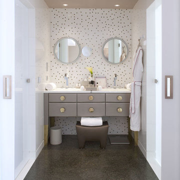 Contemporary white bathroom with grey cabinets