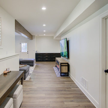 Warm & Inviting Basement Retreat with Kitchenette and Reading Nook