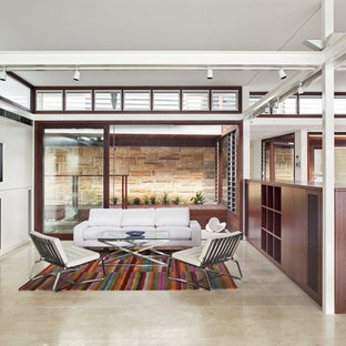 Photo of a medium sized modern open plan home cinema in Sydney with white walls, travertine flooring and a built-in media unit.