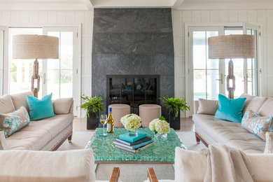 Example of a beach style living room design in Boston