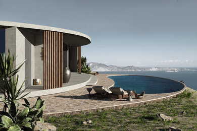 他の地域にあるラグジュアリーな地中海スタイルのおしゃれな家の外観 (コンクリートサイディング、混合材屋根、縦張り) の写真