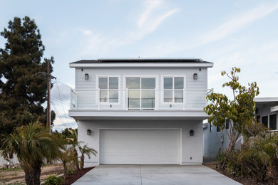 Small beach style gray two-story mixed siding and clapboard exterior home photo in San Diego with a shingle roof and a gray roof