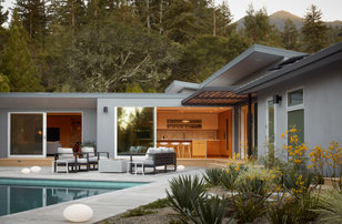 Inspiration for a huge 1950s backyard concrete patio remodel in San Francisco with a fire pit and a pergola