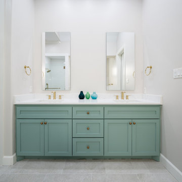 Elegant Coastal Bathroom with Sage Green Vanity & Gold Accents