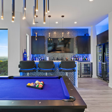 Sleek Game Room with Modern Bar and Backlit Mosaic