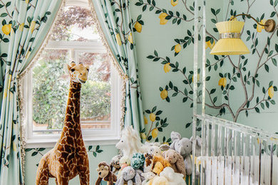 Nursery - large contemporary gender-neutral dark wood floor and brown floor nursery idea in San Francisco with green walls