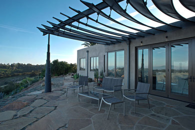 Trendy patio photo in Santa Barbara with a pergola