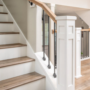 Kitchen, fireplace, and railing