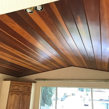 Dark wood tongue and groove paneling ceiling