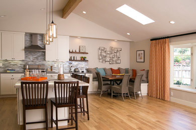 Eat-in kitchen - huge contemporary galley eat-in kitchen idea in San Francisco with shaker cabinets, white cabinets, stainless steel appliances, an island, a double-bowl sink and gray backsplash