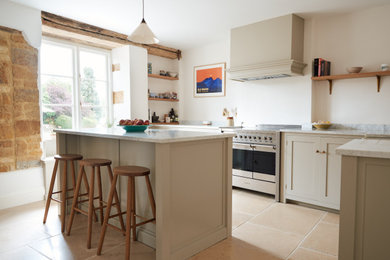 Inspiration for a classic kitchen in Other with limestone flooring and beige floors.