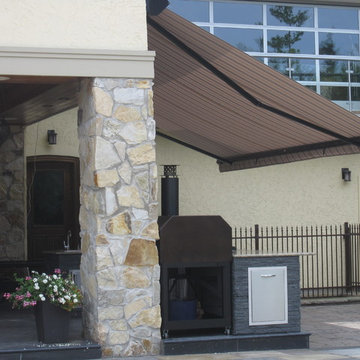 Retractable awning over outdoor kitchen