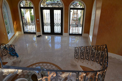 Entryway - marble floor entryway idea in Miami