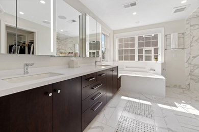 Example of a large master marble tile double-sink bathroom design in Boston with flat-panel cabinets, dark wood cabinets, white walls, white countertops and a built-in vanity