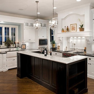 White Kitchen Cabinets With Black Island inspiration for a mid sized timeless l shaped medium tone wood floor enclosed kitchen