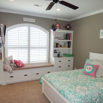 Girl's room with window seat and shelves