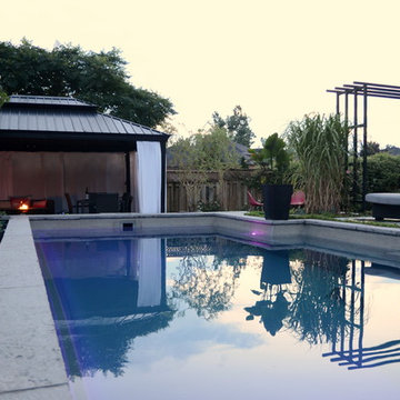 Modern Landscape with Fiberglass Pool, slab patio, water feature and more!