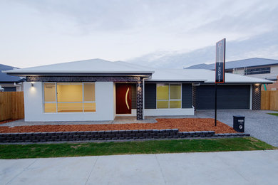This is an example of a mid-sized modern home design in Brisbane.